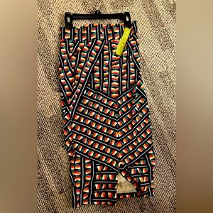 Multi colored , spandex pencil skirt, slit in front, new with tags, gianni binni